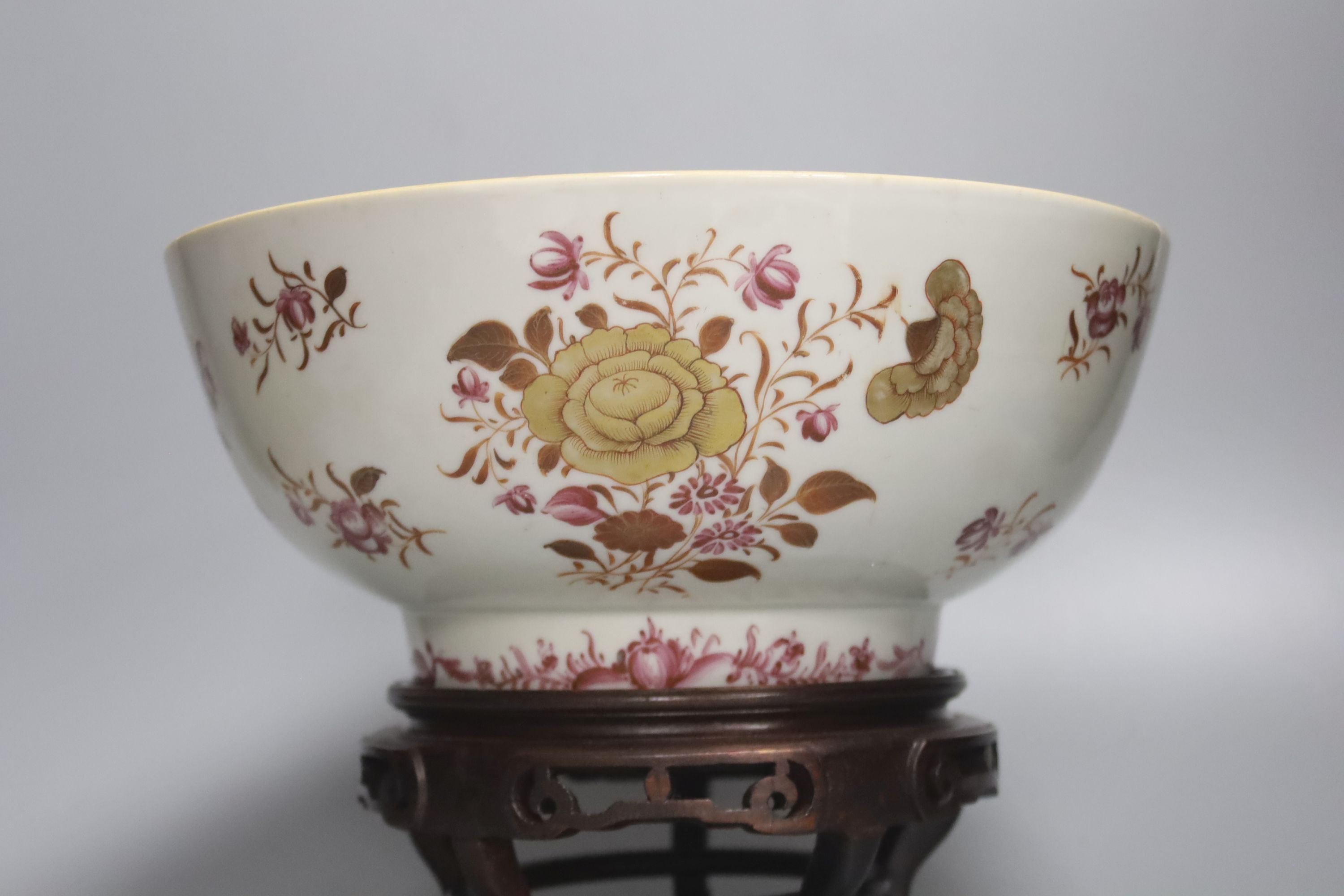 A Chinese export armorial soup plate, a large 18th century Chinese export porcelain footed punch bowl on stand, A Chinese blue and white plates and a pearlware plate